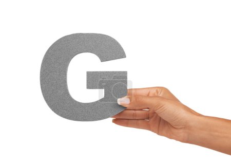 Photo for Hand of woman, capital letter G and presentation of consonant isolated on white background. Character, font and person with English alphabet typeface for communication, reading and writing in studio - Royalty Free Image