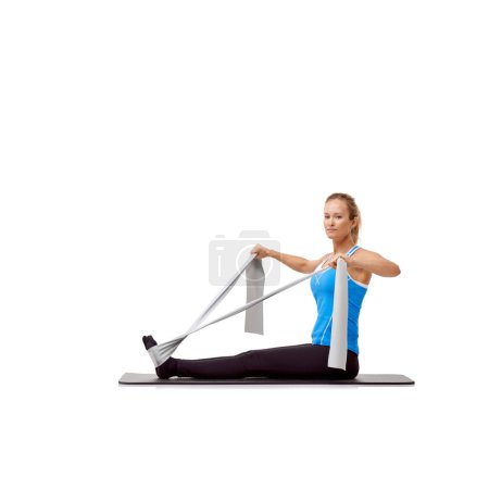 Photo for Fitness, resistance band and portrait of woman doing exercise in studio for health, wellness and bodycare. Sport, yoga mat and person from Canada with arm workout or training by white background - Royalty Free Image