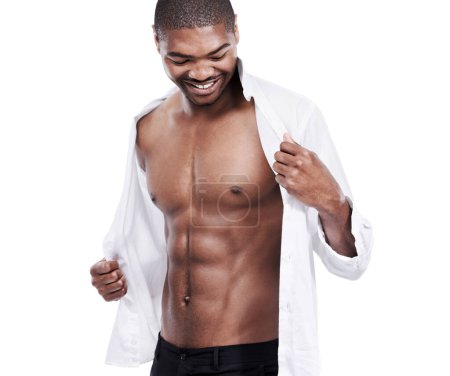 Photo for Man, fashion and muscle with abs, sexy and dressing for chest, african and male model in white background. Alone, smile and happy with six pack, shirt and corporate wear, stylish and masculine. - Royalty Free Image