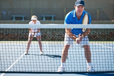 Photo for Tennis match, couple and team in outdoors, competition and playing on court at country club. People, training and exercise or racket for game, performance and practice or collaboration and challenge. - Royalty Free Image