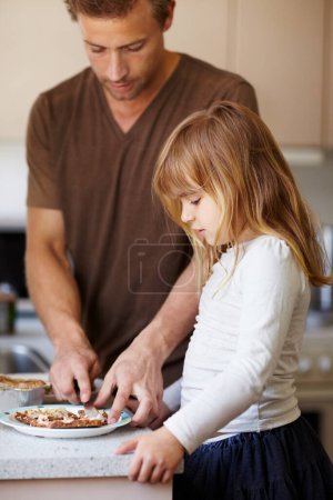 Photo for Family, breakfast or sandwich with a father and daughter in the kitchen of their home together for morning nutrition. Kids, health or diet with a man and his girl child making food, a meal or snack. - Royalty Free Image