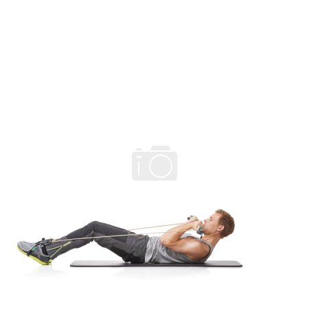Photo for Exercise, man and resistance band with fitness, energy or wellness isolated on white studio background. Mockup space, person or model with workout, health or progress with cardio, crunch or endurance. - Royalty Free Image