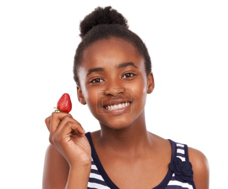 Photo for Smile, health and portrait of girl and strawberry in studio for nutrition, wellness and diet. Food, self care and vitamin c with face of African student and fruit on white background for fiber mockup. - Royalty Free Image