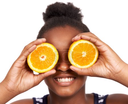 Photo for Smile, child and fruit with girl and orange in studio for nutrition, wellness and diet. Food, self care and vitamin c with face of African person on white background for fiber, citrus and detox. - Royalty Free Image