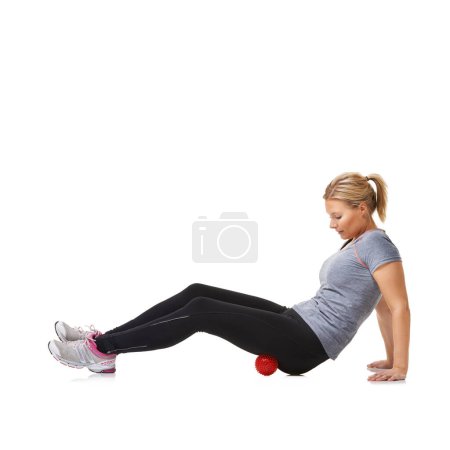 Photo for Woman, massage ball and healing for wellness, injury and health or yoga by white background. Female person, athlete and physical therapy or rehabilitation for muscles in legs and body in mockup. - Royalty Free Image