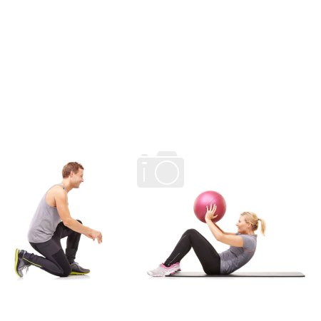 Photo for Coaching, man and woman with gym ball for fitness in studio, body wellness and support. Sports workout, fit girl and personal trainer with sphere for balance, training and power on white background - Royalty Free Image