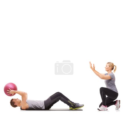Photo for Exercise, man and woman with gym ball for fitness in studio, body wellness and support. Sports workout, fit girl and personal trainer with sphere for balance, training and power on white background - Royalty Free Image