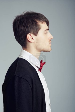 Photo for Profile, business and fashion with man, thinking and confident guy on grey studio background. Person, entrepreneur or model with stylish outfit, elegant clothes or worker with professional or bow tie. - Royalty Free Image