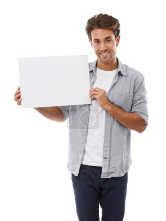 Photo for Portrait, advertising and man on poster, smile and mockup space isolated on a white studio background. Happy person show paper banner, sales promotion and blank placard presentation, sign and info. - Royalty Free Image