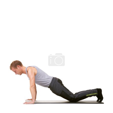 Photo for Man, fitness studio and push up exercise on knees for workout, power and energy on mockup white background. Profile of healthy guy balance on mat for strong core, training or plank challenge on floor. - Royalty Free Image