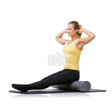Photo for Studio workout, foam roller and pilates woman with posture training, core wellness challenge or stretching exercise for recovery. Ground, yoga mat and athlete physical activity on white background. - Royalty Free Image
