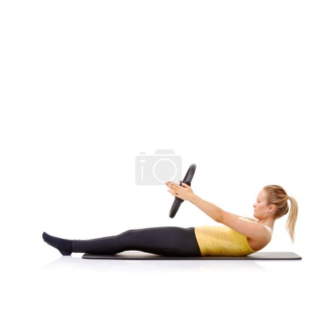 Photo for Pilates ring, fitness and woman exercise in studio isolated on a white background mockup space. Training, person on mat and magic circle for crunches, strong abdomen and healthy body workout on floor. - Royalty Free Image