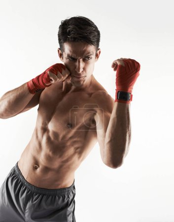 Photo for Man, kick boxer and topless in gym, serious and face for workout, boxing and strong. Exercise, sports and training for power, self defense and concentration for challenge, mma and fighting skills. - Royalty Free Image