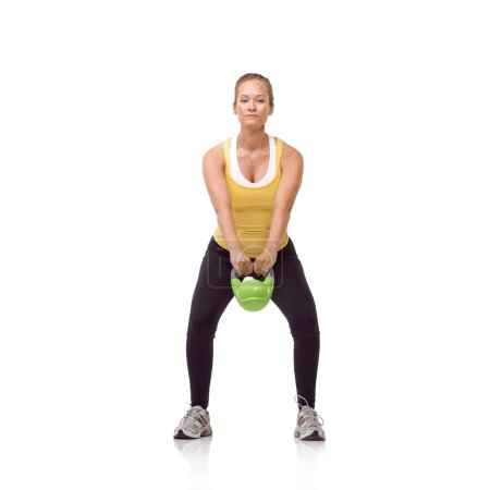 Photo for Workout, portrait or studio woman with kettlebell swing for muscle growth, strong arm strength or heavy weight lifting. Exercise equipment, gym circuit routine or bodybuilder girl on white background. - Royalty Free Image