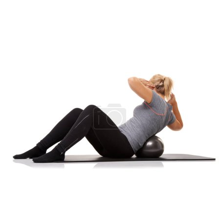 Photo for Fitness, exercise and woman on floor with ball for pilates, body building care and health in studio. Gym, training and girl on mat with cardio, energy and muscle workout isolated on white background - Royalty Free Image