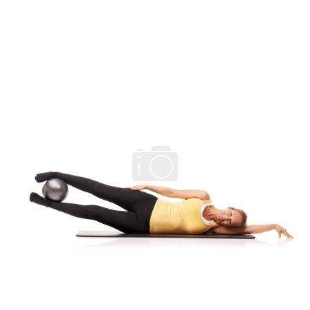 Photo for Woman, portrait and ball or legs wellness for abductor squeeze exercise, strong thighs or white background. Female person, face and equipment in studio for health balance, lifting or mockup space. - Royalty Free Image