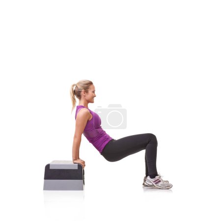 Photo for Woman, aerobics step and exercise in studio profile with smile, training or health by white background. Girl, person and mockup space for workout, fitness or wellness on floor with balance for muscle. - Royalty Free Image