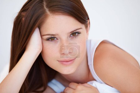 Photo for Smile, beauty and portrait of woman on bed for relaxing with positive, good and confident attitude. Happy, calm and young female person from Canada laying and resting in bedroom of modern apartment - Royalty Free Image