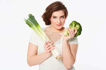 Photo for Woman, health and portrait by vegetables in studio, nutrition and wellness in vegan diet in mock up. Person, face and broccoli by natural food, vitamins and detox in organic salad by white background. - Royalty Free Image