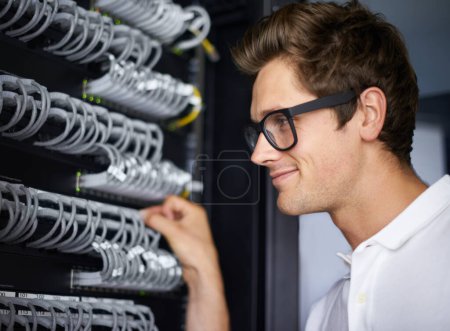 Photo for Server room, information technology and man with cables for connectivity, night and check hardware. Cybersecurity system, it network or person for internet, data center or storage solution with ideas. - Royalty Free Image