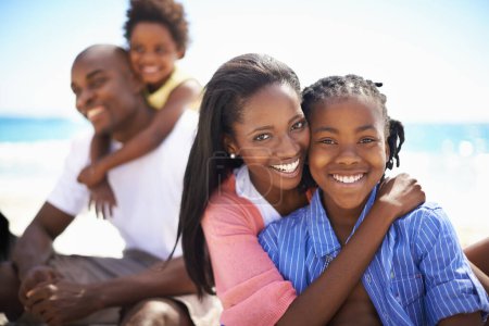 Photo for African family, parents or children and hugging at beach for adventure, holiday or vacation in summer. Black people, face or smile outdoor in nature for embrace, experience or bond and relationship. - Royalty Free Image
