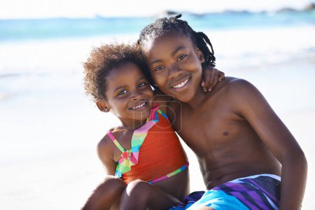 Photo for Portrait, black kids and happiness on beach with costume for adventure, holiday or vacation in summer. African sibling, face and smile outdoor in nature for break, experience or bonding with embrace. - Royalty Free Image