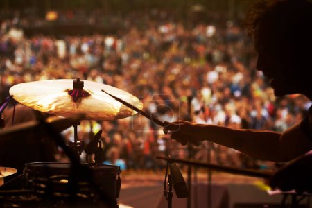 Photo for Drummer, music and crowd at stage, concert or musician in performance at festival or event with fans. Playing, rock or man on drums in a metal band with audience listening to beat, sound or show. - Royalty Free Image