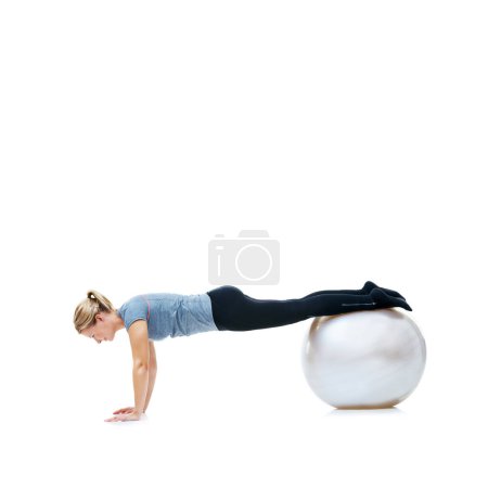 Photo for Yoga ball, fitness and woman in studio with body, health and wellness exercise for balance. Sports, equipment and young female athlete with stretching workout or training isolated by white background. - Royalty Free Image