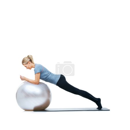 Photo for Woman, ball or stretching in studio space for workout, wellness or mobility exercise on white background. Legs, training equipment or athlete fitness for core challenge, balance or flexibility mockup. - Royalty Free Image