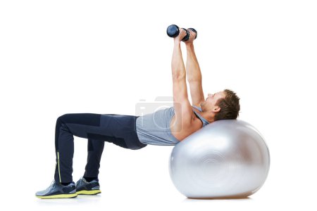 Photo for Man, exercise ball or balance in dumbbell workout performance, wellness or studio on white background. Strong male athlete, training equipment or fitness for mockup space, body challenge or weights. - Royalty Free Image
