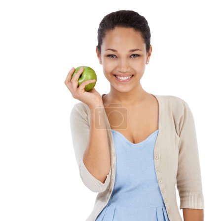 Photo for Portrait, apple and happy woman in studio with healthy food choice, healthcare or nutrition benefits. Face of person or model with green fruit for detox, self care or vegan diet on a white background. - Royalty Free Image