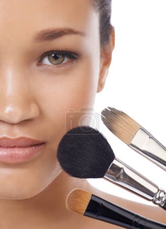 Photo for Makeup, brushes and portrait of young woman in studio for beauty, foundation and cosmetics. Face of a model, MUA artist and person with skincare, application tools and product on a white background. - Royalty Free Image