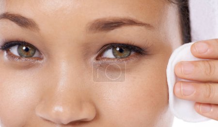 Photo for Woman portrait, cotton pad and closeup for skin care, beauty and cosmetics product with dermatology results in studio. Face of person or model eyes with hygiene wipe for makeup on a white background. - Royalty Free Image