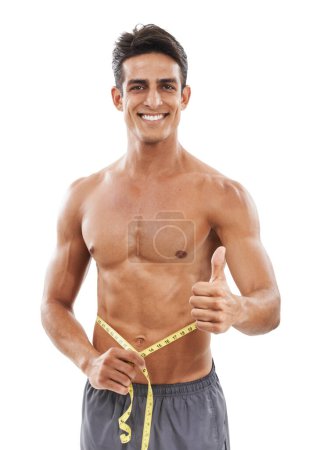 Photo for Happy man, portrait and thumbs up with tape measure for fitness, success or diet against a white studio background. Handsome and muscular male person with like emoji or yes sign for workout exercise. - Royalty Free Image