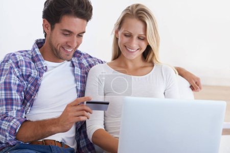 Photo for Happy couple, laptop and credit card for ecommerce, payment or banking together in relax at home. Man and woman smile with debit on computer for online shopping, transaction or fintech at house. - Royalty Free Image