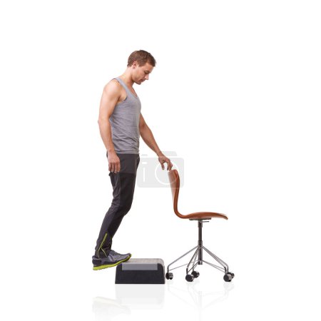 Photo for Fitness, chair and young man in studio for health, wellness and body workout with step. Sports, equipment and male athlete training muscles with leg exercise for strength isolated by white background. - Royalty Free Image