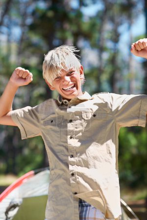 Photo for Child, portrait or arms raised in nature for success, winning or goal on holiday vacation in woods. Forest, summer or excited male kid with smile for victory, freedom or camping in woods or park. - Royalty Free Image