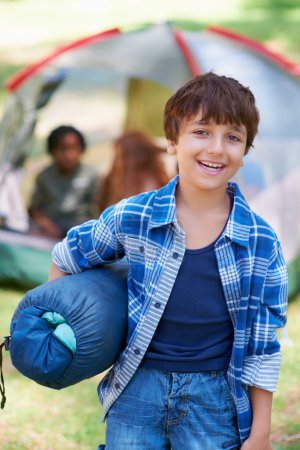 Photo for Sleeping bag, camping or portrait of happy boy in forest on adventure or holiday vacation in nature. Relax, start or kid with smile in park, garden or woods ready for fun hiking, travel or wellness. - Royalty Free Image