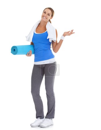 Photo for Yoga mat, fitness and portrait of woman in studio with mockup space for exercise or workout. Happy, equipment and portrait of young female person with show gesture for sports by white background - Royalty Free Image