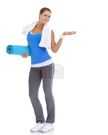 Photo for Yoga mat, hand and portrait of woman in studio with mockup space for exercise or workout. Happy, equipment and young female person with show gesture for fitness or sports isolated by white background. - Royalty Free Image