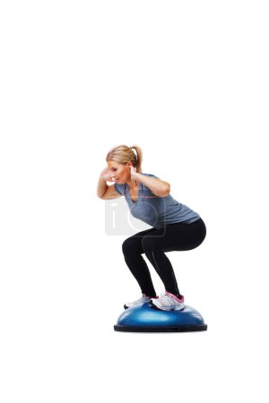 Photo for Woman, workout and squat with balance ball for fitness, exercise or training on a white studio background. Active female person squatting for strength, muscle or strong glutes on mockup space. - Royalty Free Image