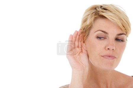 Photo for Ear, hand and woman with secret in a studio with mockup space for advertising or marketing. Gossip, communication and female person with listening gesture isolated by white background with mock up - Royalty Free Image