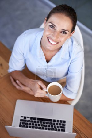 Photo for Portrait, business woman and coffee at laptop for break from planning online research at desk from above. Happy employee, office worker and lady drinking tea, beverage and mug at computer in company. - Royalty Free Image