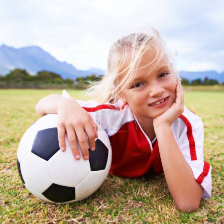 Photo for Girl, soccer player and ball with portrait, smile and ready for game, field and child. Outdoor, playful and sport for childhood, happy and athlete for match, alone and outside on football pitch. - Royalty Free Image