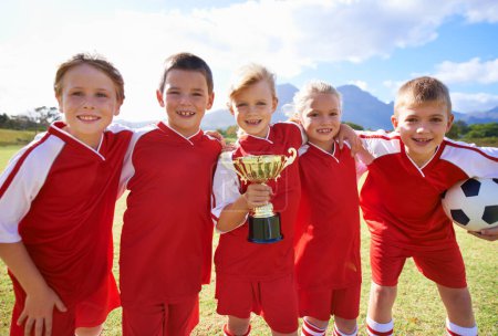 Photo for Portrait, soccer team and children with cup, boys and girls with victory, support or proud. Achievement, sports and friendship, together and happy for win, ready for game or physical activity. - Royalty Free Image