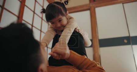 Photo for Father, home and play with daughter, happy and smile for joy, japanese and childhood memories. Dad, girl and fun with child, living room floor and parenting together with love, carefree and caring. - Royalty Free Image