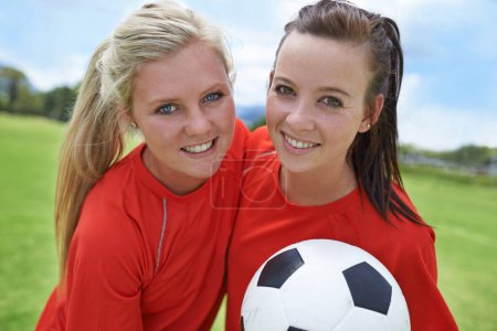 Photo for Girls, soccer players and portrait with ball, field and football pitch for match, competition or game. Fitness, practice and ready for training, outdoor and exercise for athlete, happy and sport. - Royalty Free Image