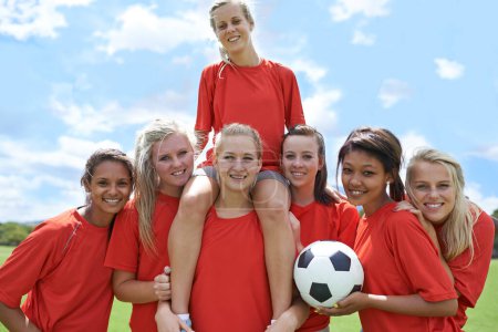 Photo for Women, soccer players and portrait with ball, confidence and football field for match, competition or game. Fitness, practice and happy for training, outdoor and exercise for athlete, girls or sport. - Royalty Free Image