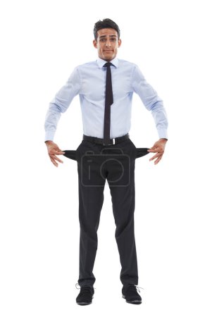 Photo for Business man, empty pockets and studio portrait for financial crisis in recession by white background. Entrepreneur, employee and person with no money, stress and inflation in economy, pants and poor. - Royalty Free Image