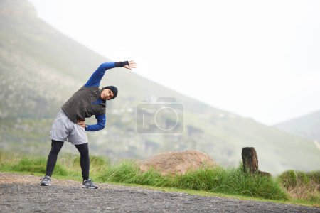 Photo for Man, stretching and start fitness outdoor, mountain and nature with runner and exercise. Workout, training and warm up in road, ready for race or cardio with endurance for health, running and sports. - Royalty Free Image